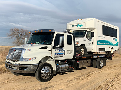 Tow Truck Towing Mini-Bus in Aurora, CO