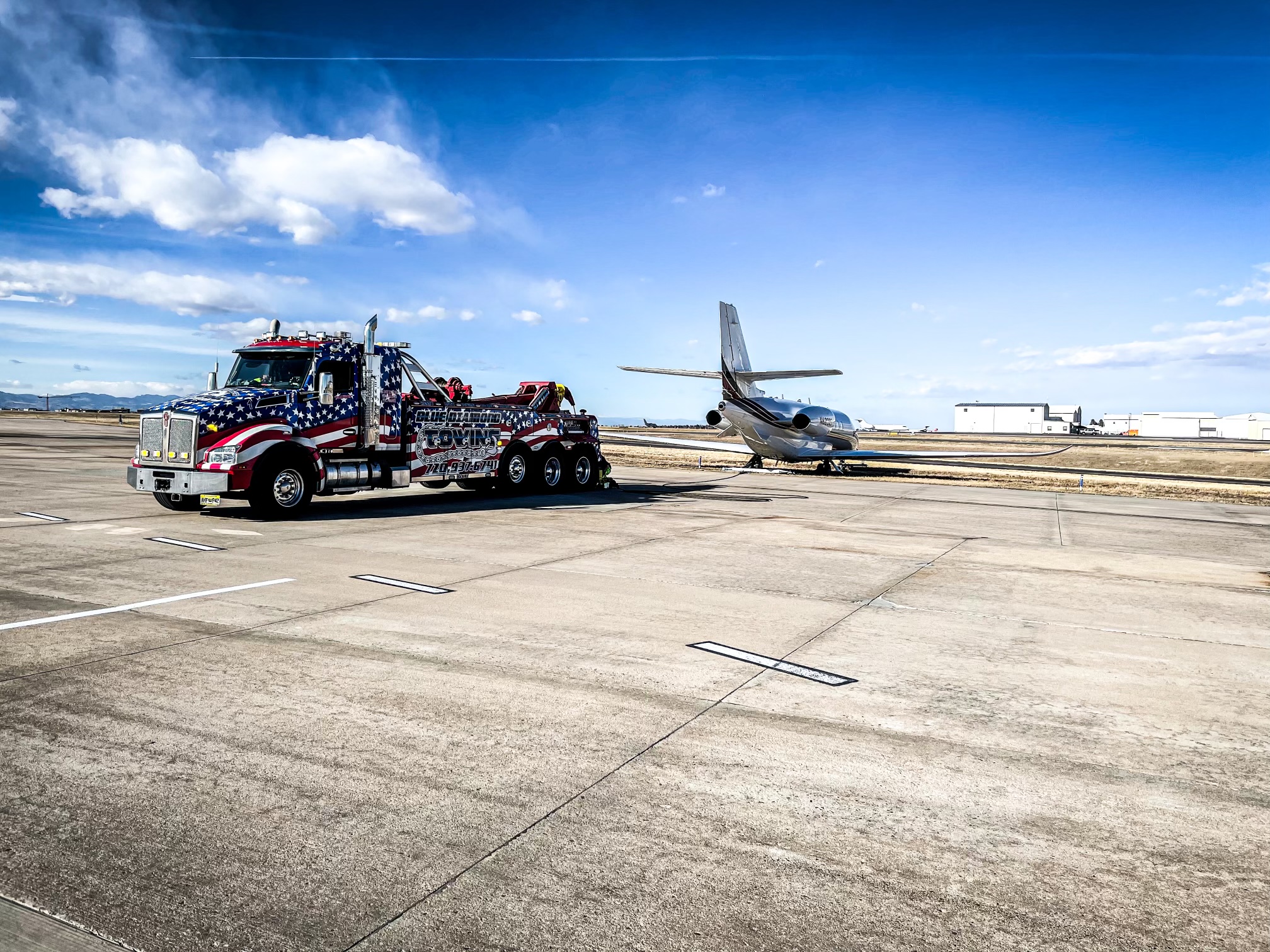Truck Parked Near a Plane